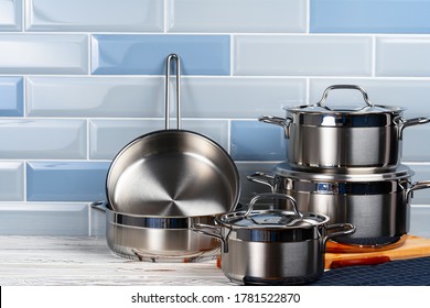 Set of aluminum cookware on kitchen counter