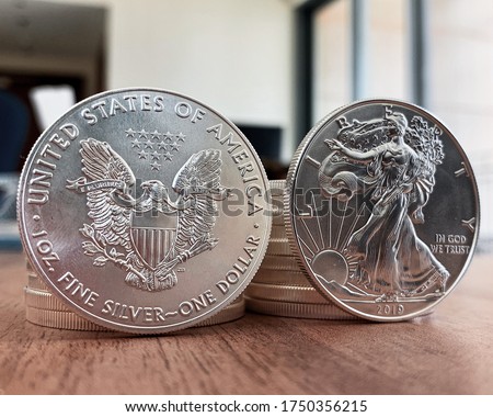Set of American silver eagle coins, highlight the front and back side of the silver coin