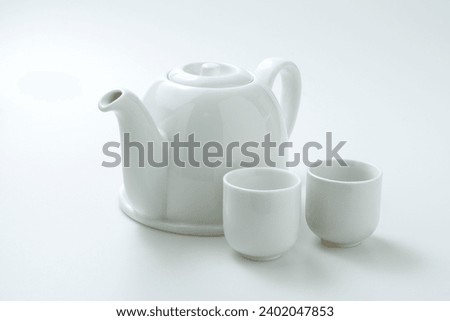 Set of antique Chinese Tea pot cup isolated on white background. Vintage porcelain Japanese teapot with teacup on white table, Asian drink lifestyle concept. China coffee mug, top view