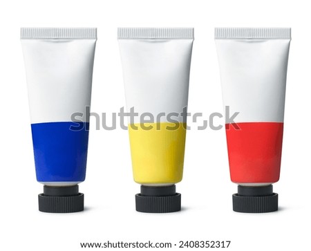 set of artist's paint tubes with black cap isolated on white background, art supplies of primary colors blue, yellow and red, mock-up template of oil or acrylic or watercolor paint