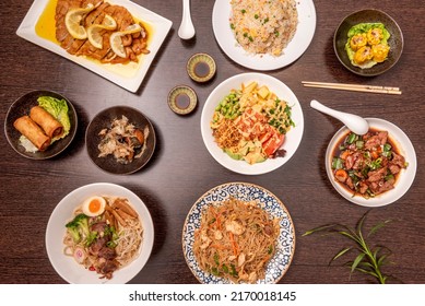 Set of asian food dishes with spring rolls, lemon chicken, three delight rice, spicy beef and pork ramen and noodles - Powered by Shutterstock