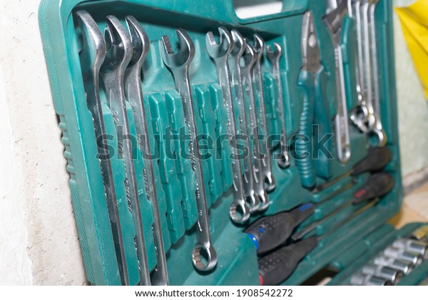 A set of auto tools in a green suitcase. Car\
repair tools.