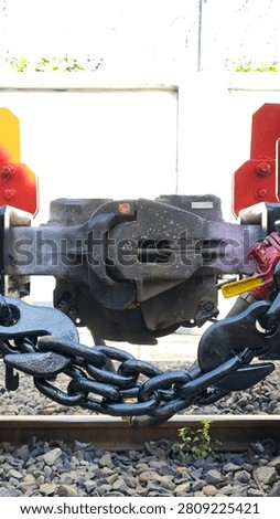 A set of automatic couplers between two caboose