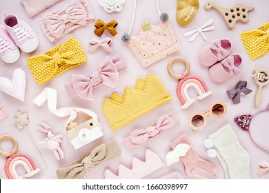 Set Of  Baby Girl Accessories On Pink Background. Various Head Band And Hair Bow, Toy, Little Shoes, Socks. Fashion Kids Stuff And Accessories. Flat Lay, Top View