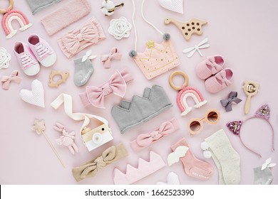 Set Of  Baby Girl Accessories On Pink Background. Various Head Band And Hair Bow, Toy, Little Shoes, Socks. Fashion Kids Stuff And Accessories. Flat Lay, Top View