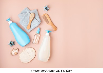 Set Of Baby Toiletries, Child Organic Hygiene And Bath Accessories, Shower Gel, Shampoo, Essential Oil, Towel On Pink Pastel Background. Top View, Flatlay