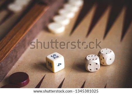 Set up backgammon game. Dice on a wooden board game. Selective focus