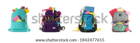 Set of backpacks with bright school stationery on white background, banner design