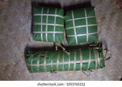 Set of "Banh Chung" or Chung cake put on flat winnowing basket