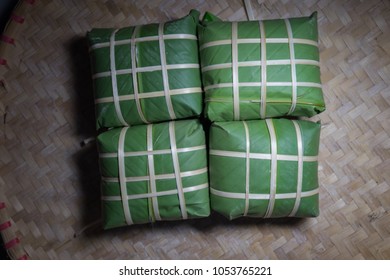 Set of "Banh Chung" or Chung cake put on flat winnowing basket