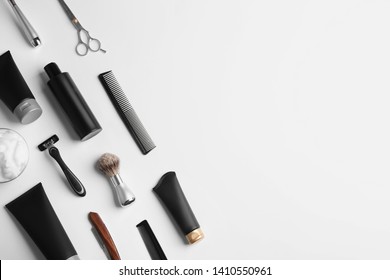 Set of barber's equipment and men's cosmetic products on light background, top view. Space for design