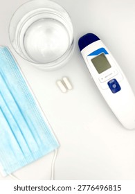 A set of basic necessities for colds on a white background. Top view.