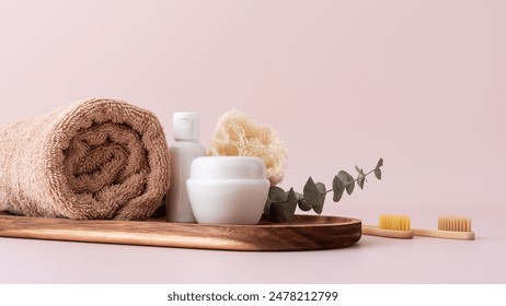 Set of bath and self care products for bathroom, spa and wellness. Body care still life with cotton towel, soap, serum bottle and bamboo toothbrushes. - Powered by Shutterstock