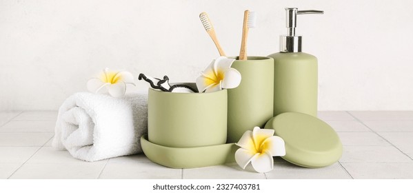 Set of bathing cosmetics and accessories on light tile table - Shutterstock ID 2327403781