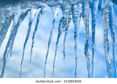 set of big icicles on sky background