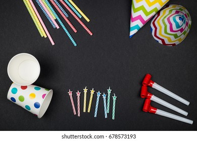 Set Of Birthday Party Items On Black Surface View From Above