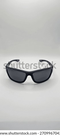 A set of black, athletic, rectangular sunglasses, presumably designed for outdoor pursuits.