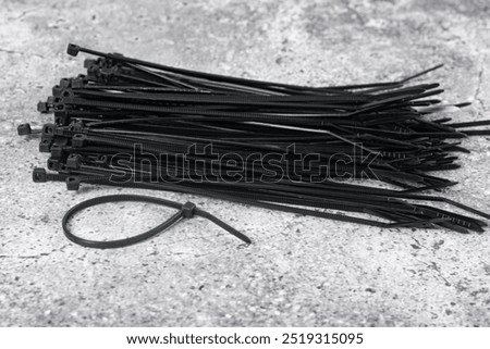 A set of black plastic cable ties.