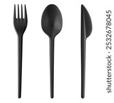 Set of black plastic disposable tableware - knife, spoon, fork, isolated on white background.
