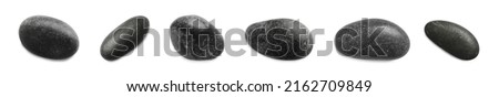 Set with black spa stones on white background. Banner design