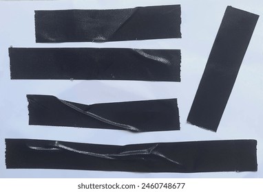 Set of black tapes on white background. Torn horizontal and different size black sticky tape, adhesive pieces.