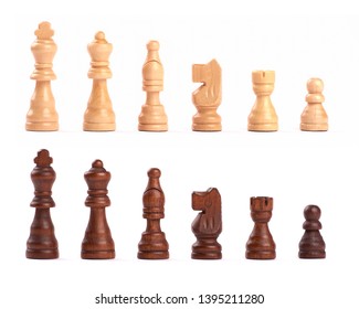 Set of black and white wooden chess figures standing in a row isolated on white background