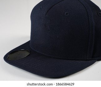 Set Blank Blue Hip Hop Cap For Template. Snap-back Base Cap On A White Background. Rap Cap Template, Flat Bill Baseball Cap. 
Blue Hat Isolated On White Background.