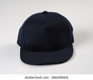 Set Blank Blue Hip Hop Cap For Template. Snap-back Base Cap On A White Background. Rap Cap Template, Flat Bill Baseball Cap. 
Blue Hat Isolated On White Background.