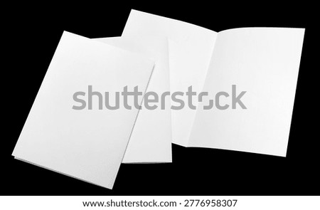 Set of blank folded paper sheets, isolated on black background