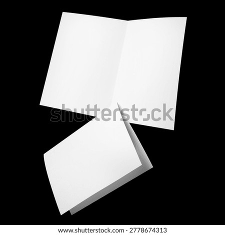 Set of blank folded paper sheets, isolated on black background