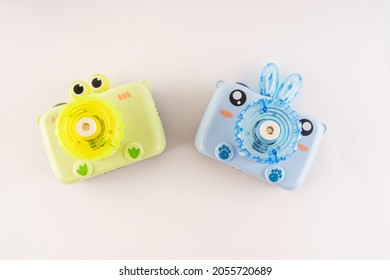 A set for blowing bubbles in the form of a camera for children.