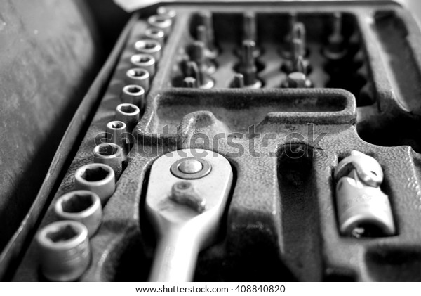 set box\
of fixing tools for cars in black and white\

