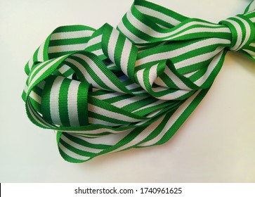 A Set Of Broad Band With A Combination Of Green And White Insulated By A White Background