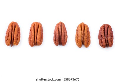 Set of Brown pecans piles isolated on a white background.