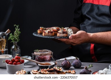Set Bruschettas with figs and goat cheese, Blue cheese and nuts, onion jam, fresh thyme, honey on grilled crusty bread, tasty appetizer wine, banner, catering menu recipe. - Shutterstock ID 2206370557