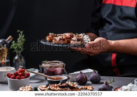 Set Bruschettas with figs and goat cheese, Blue cheese and nuts, onion jam, fresh thyme, honey on grilled crusty bread, tasty appetizer wine, banner, catering menu recipe.