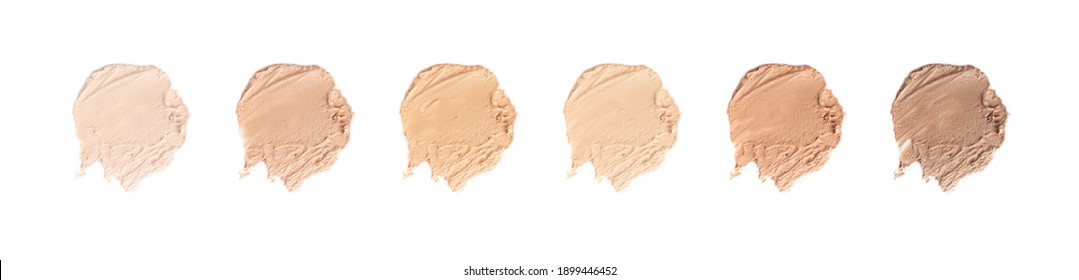Set of brush strokes for makeup in different colour isolated on white background. Foundation face make-up samples, texture of face concealer. Make up smears, cosmetic, foundation colors palette 