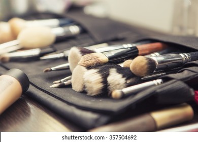 Set Of Brushes (make Up Application Tools) Laying On A Table Randomly