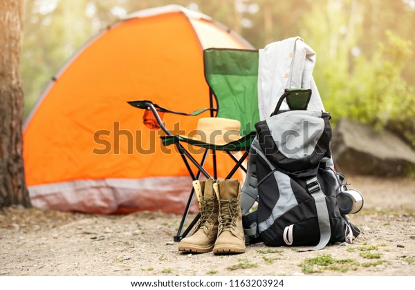 Set of
camping equipment outdoors on summer
day