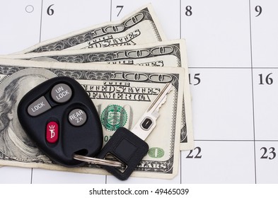 A Set Of Car Keys With Cash On A Calendar, Car Payment Is Due