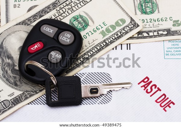 A set of car keys with cash and a past due bill,\
Past due car payment