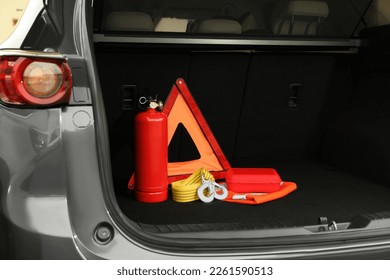 Set of car safety equipment in trunk - Shutterstock ID 2261590513