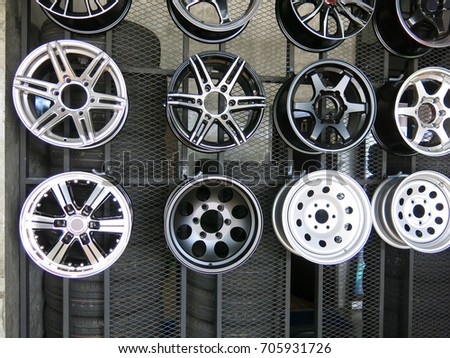 Set of car wheel disks, on shelf.
