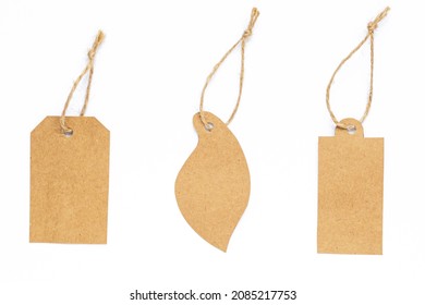 Set Of Cardboard Gift Tag With Space For Text Isolated On White In The Shape Of A Leaf With Wood, Ecological Tag