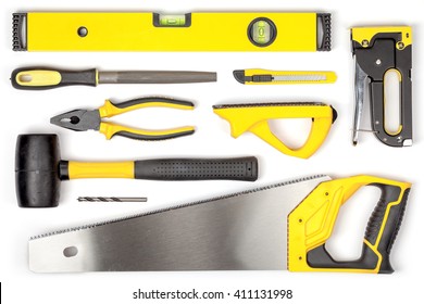 set of carpentry tools on white background with copy space top view. carpenter working table. carpentry and woodwork industry flat lay concept
