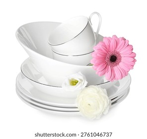 Set of ceramic dishware and spring flowers isolated on white
