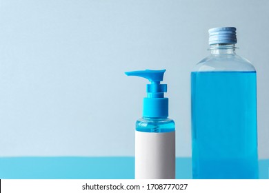 Set Of Chemical Blue Isopropyl Alcohol (Ethanol Or Ethyl Alcohol) Liquid In A  Plastic Press Pump Head Blue Bottle With Blank Label For Medical And Prevent From Germs, Bacterial,coronavirus COVID-19.