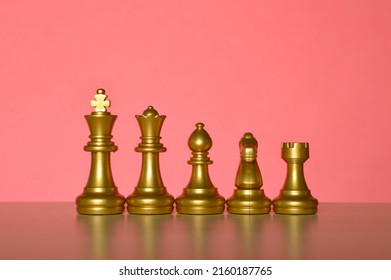 Set Of Chess Figures In A Row Isolated On A Red Background