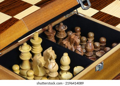 A Set Of Chess Men In An Open Wooden Box