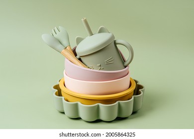 Set of children's bowls, plates and spoon. Baby tableware. Nutrition and feeding concept. - Shutterstock ID 2005864325